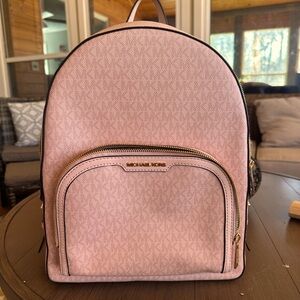 I am selling a Micheal Kors backpack purse .